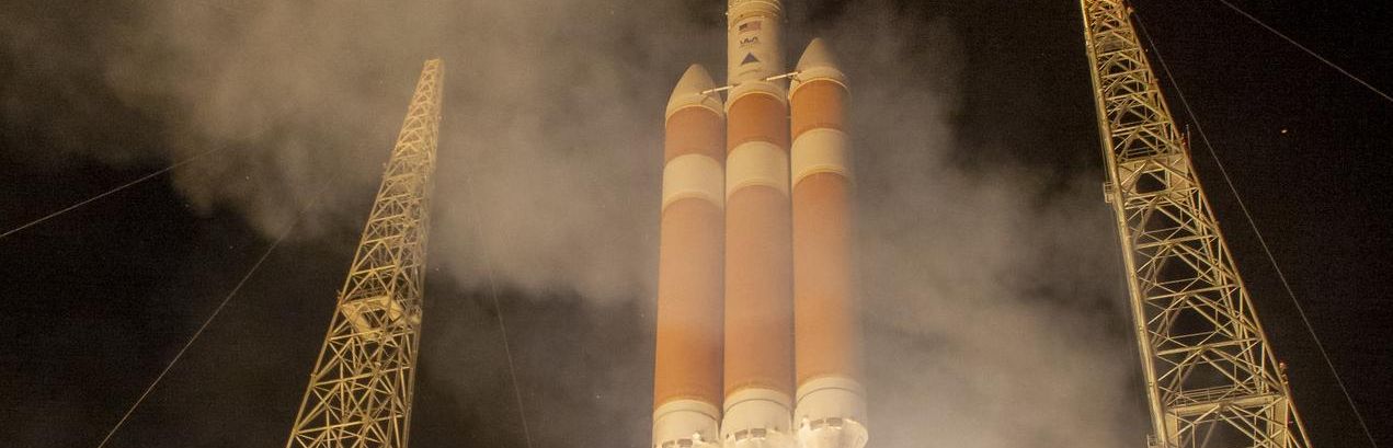 Delta IV Heavy rocket launching at night